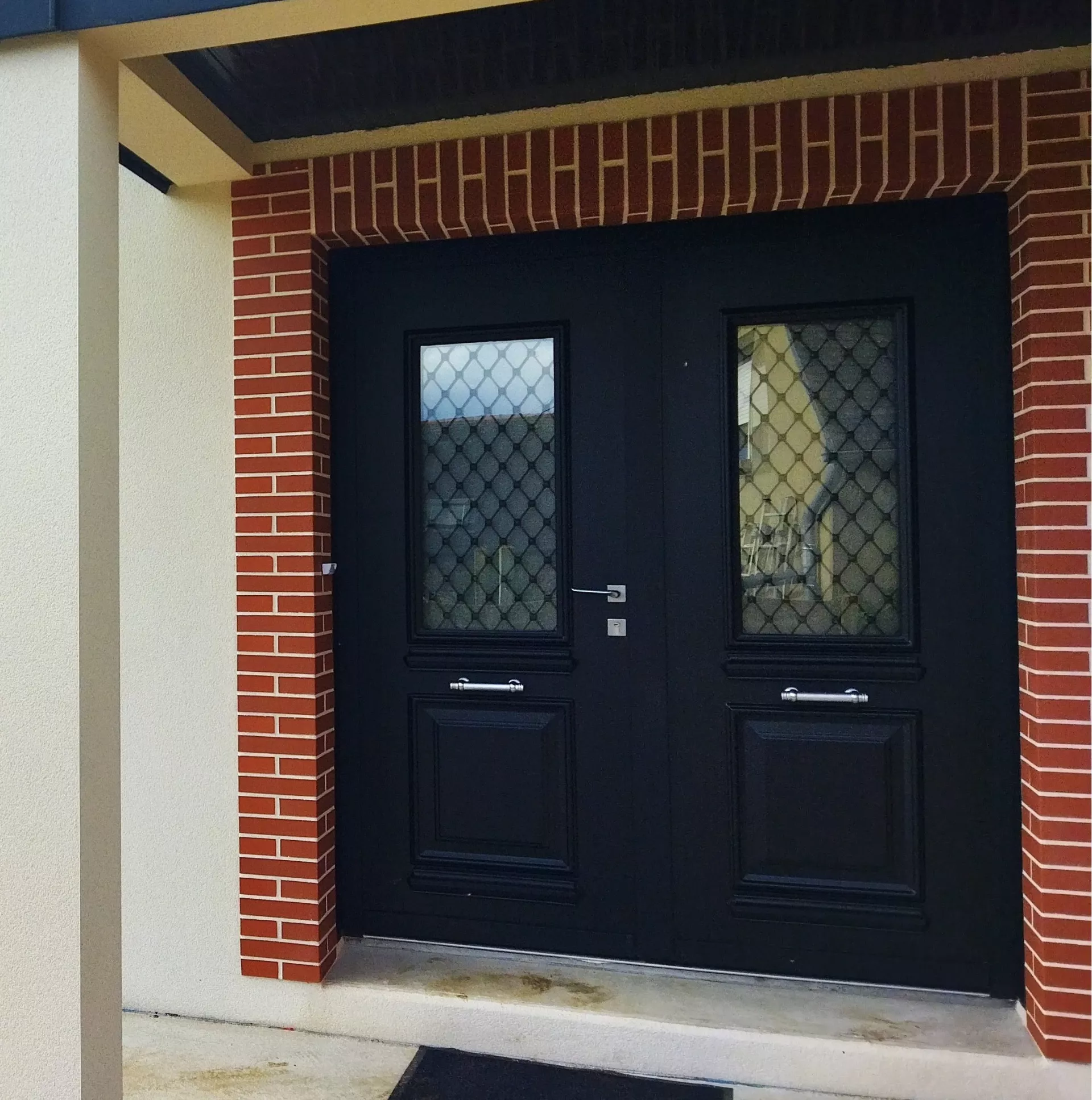 Porte Saline double avec grille pointe de diamant et barre de tirage inox noire RAL9005 à Lantic 22410